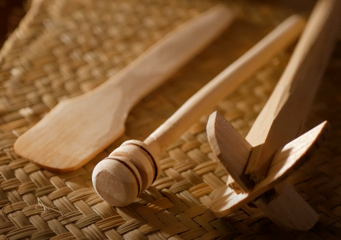 Wooden molinillos to prepare ceremonial cacao.